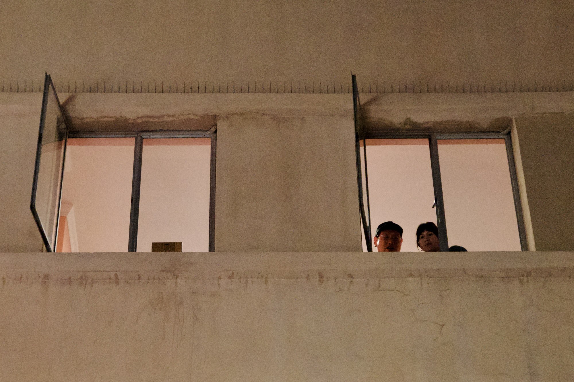 People framed by a window