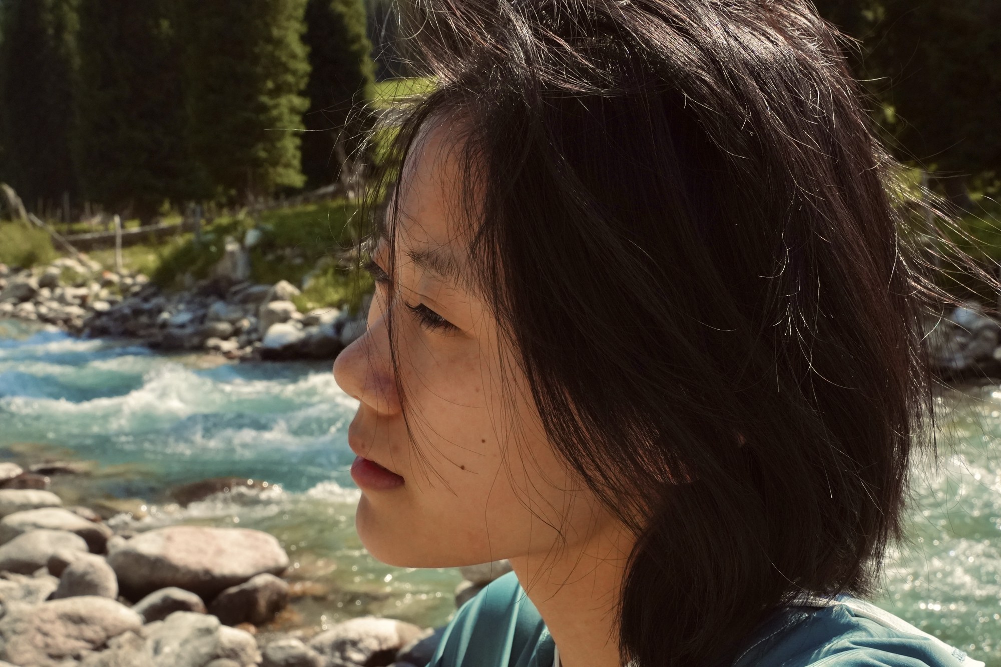 A portrait beside a river
