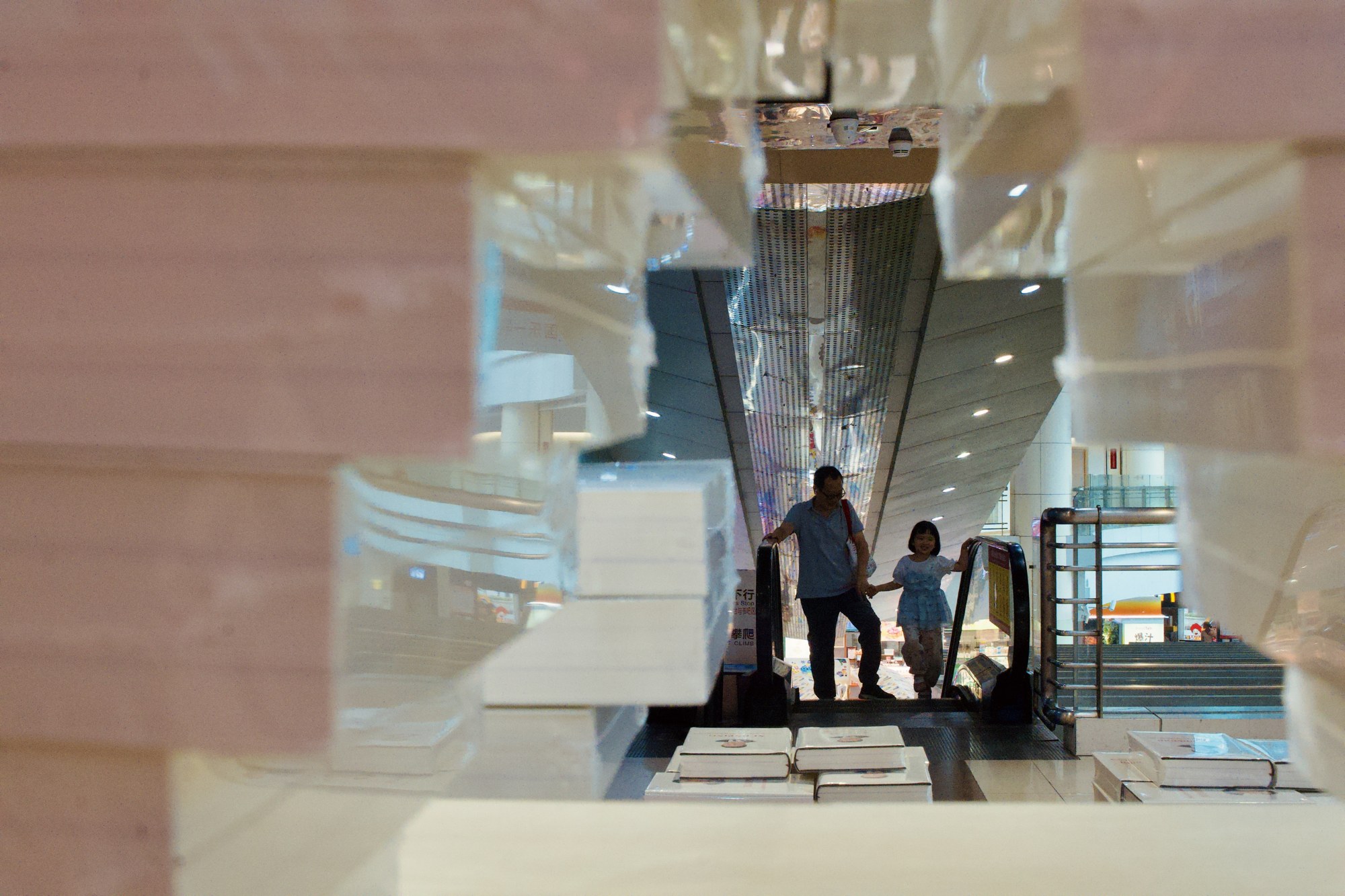 People reflected in a glass interior