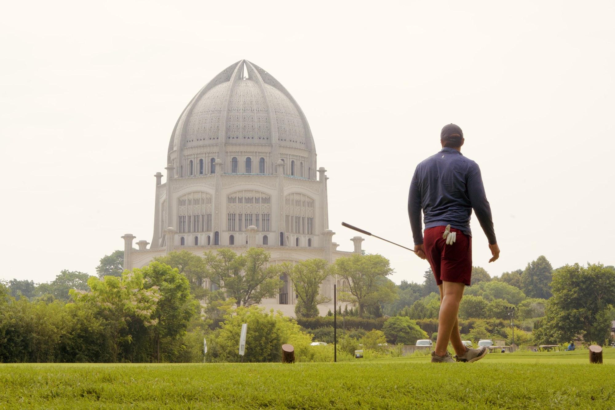 A person approaching a domed building