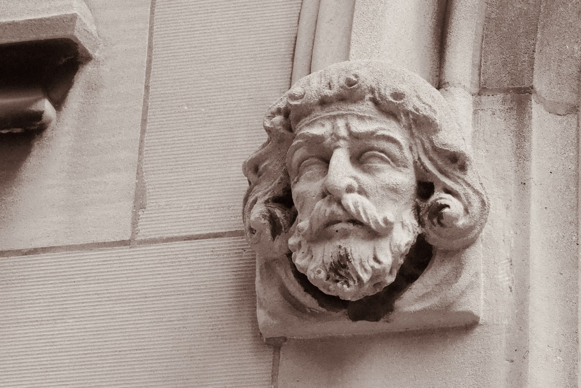 A carved face on a building