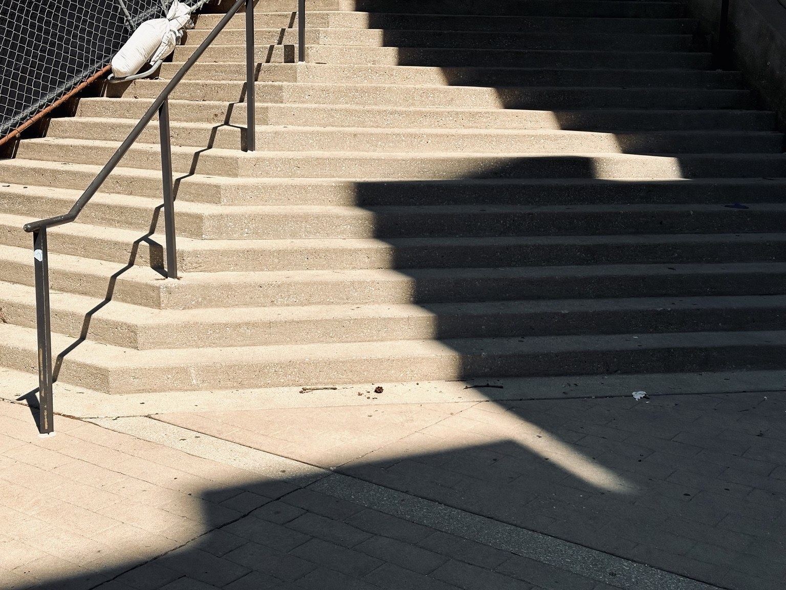 Sunlight and shadow dividing an outdoor staircase