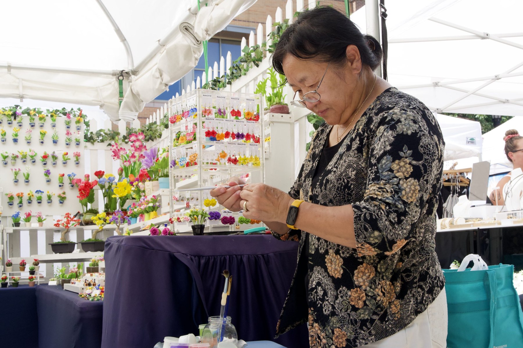 May Xiong crafts each air-dry clay piece petal by petal. The material allows her to preserve the permanence of nature.