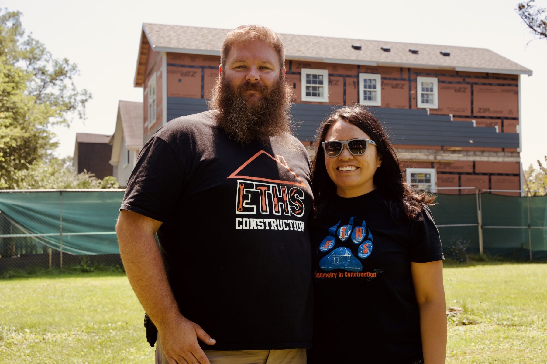 Co-teachers of “Geometry in Construction” Matthew Kaiser (left) and Maryjoy Heineman in front of the assembled two-story house.
