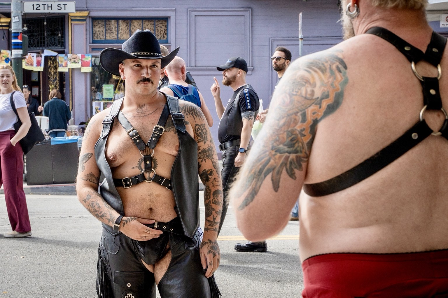 Fairgoers wearing leather harnesses gather on a street at the 43rd annual Folsom Street Fair in San Francisco on Sept. 27, 2026.