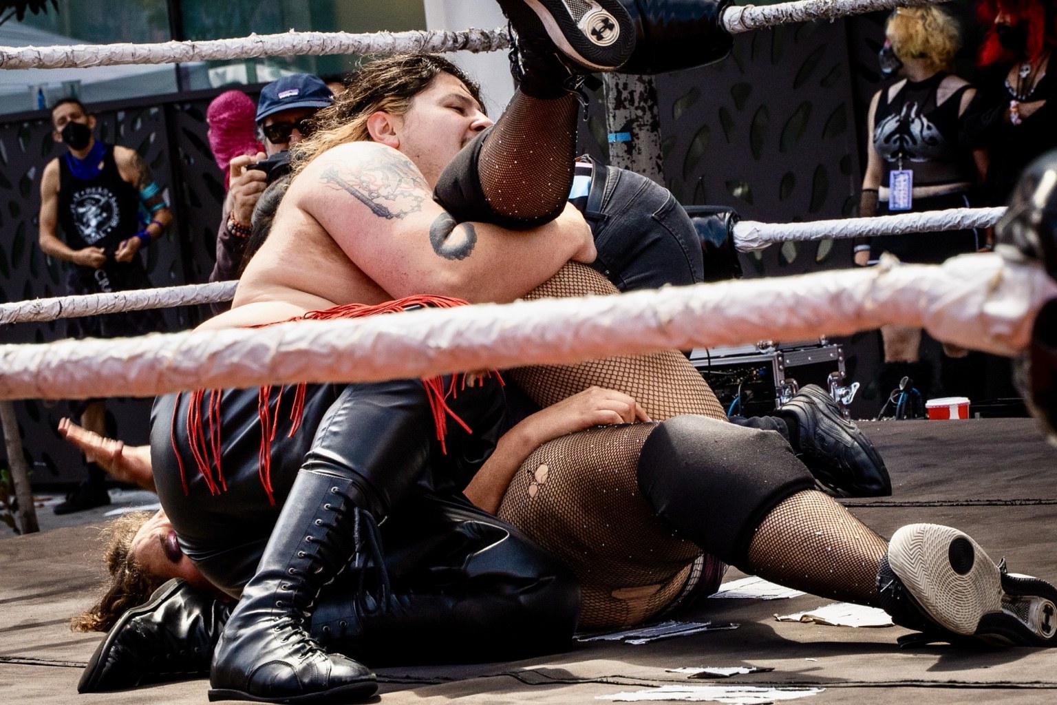 Wrestlers compete in a ring surrounded by spectators at the 43rd annual Folsom Street Fair in San Francisco on Sept. 27, 2026.
