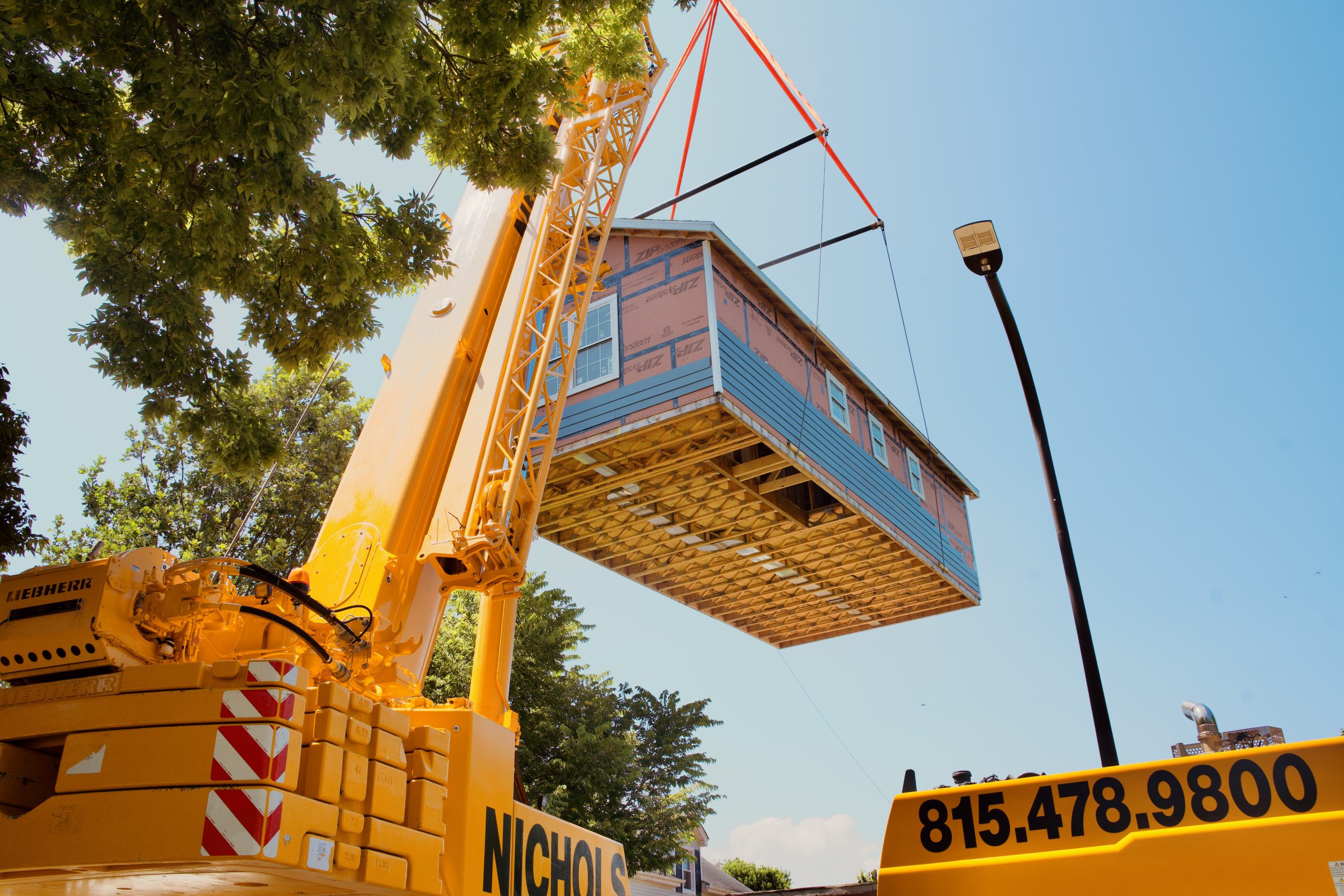 Justin Kreger, president of Vertical Works, who oversees the project, said the most challenging part of the process was maneuvering the house to avoid the tree canopy. Being “slow and steady” is key, he said. The first story was placed in the morning and the second story was placed in the afternoon.